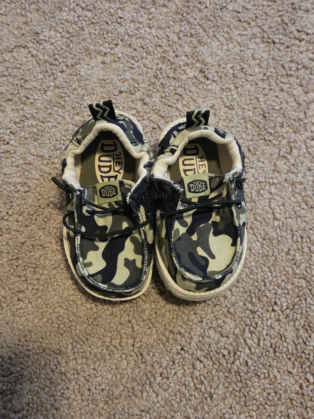 Hey Dude Kids Camo Slip-On Shoes in Green, Black, Tan